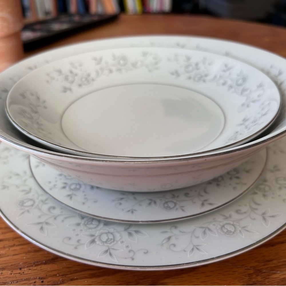 Fine China 4 of each pieces White with silver trim. Plate set.